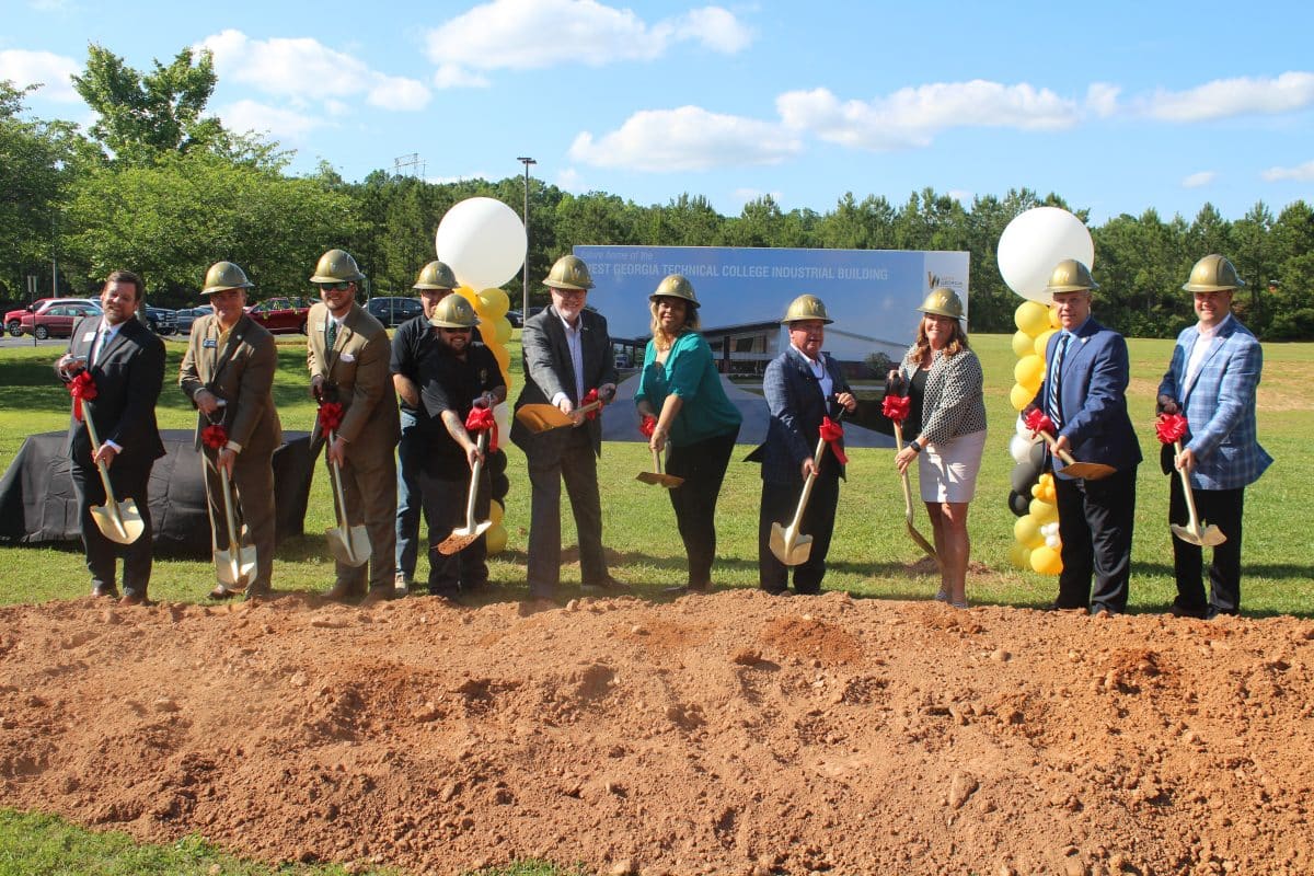 industry partners shoveling dirt at the ceremony