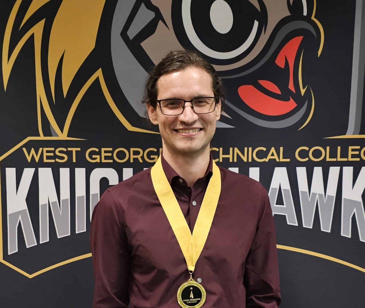 Matthieu Pilon holding award