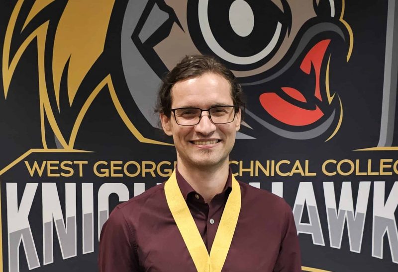 Matthieu Pilon holding award